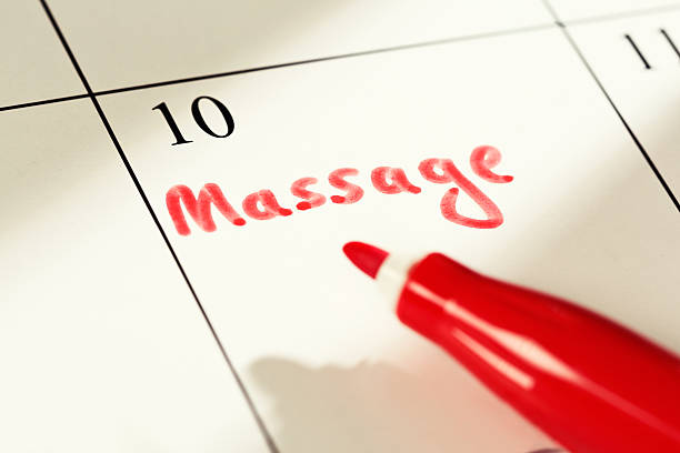istock Note on calendar reads Massage. Something to look forward to! 519254085