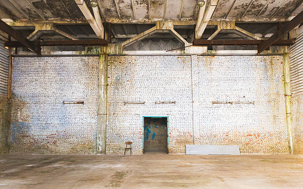 istock brick wall in an abandoned factory 519263712