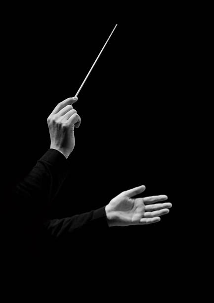 istock Hands of conductor on a black background 519263934