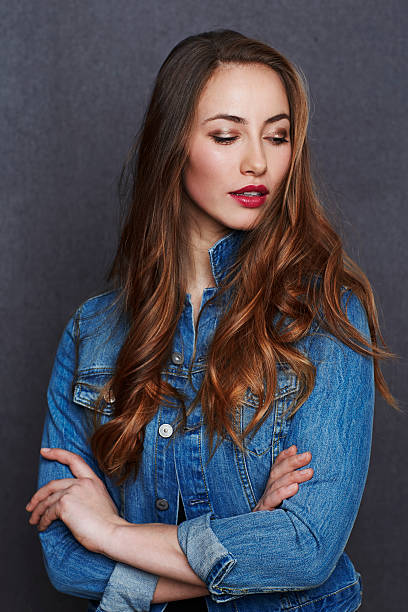 istock Beautiful brunette looking away in studio 519269112