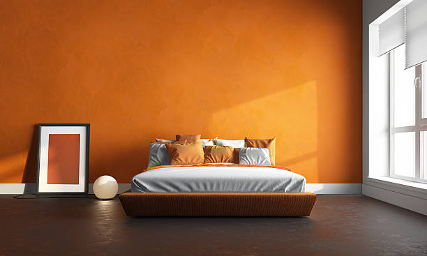 3d render of orange bedroom stock photo