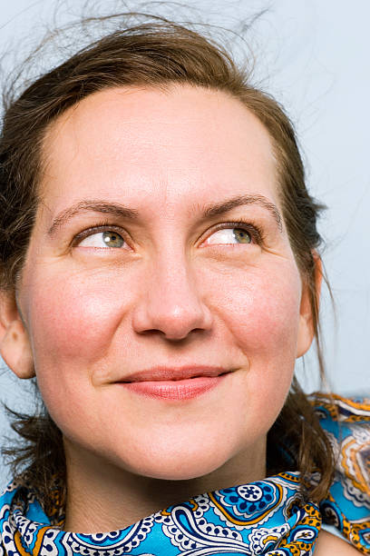 istock Woman looking to side, smiling, close-up 519282115