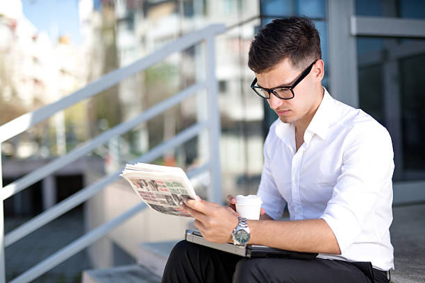istock Business Man With Coffee and Newspaper 519307744