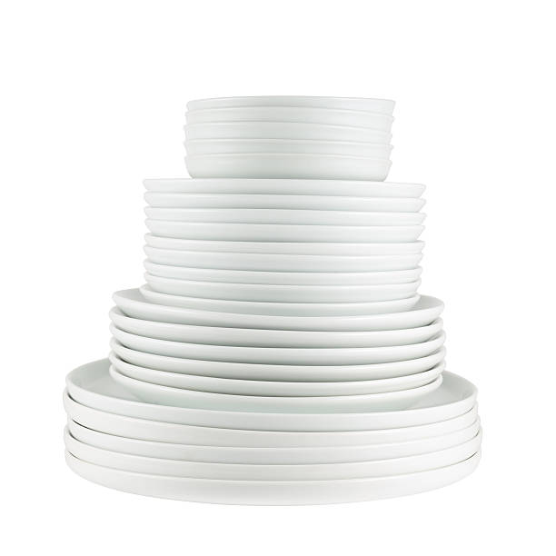 istock Pile of clean white dish plates isolated 519308070