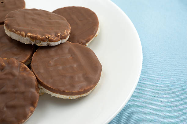 istock Organic rice cookies with milk chocolate icing on plate 519308952