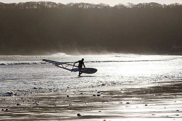 windsurfer-gower - wales beach editorial people стоковые фото и изображения