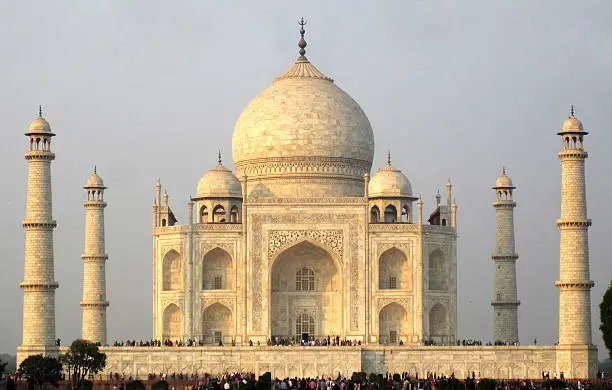 Photo of full frame view of Taj Mahal, with people crowd