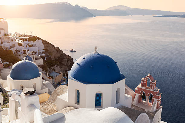 istock Sun on the blue domes in Oia 519310394
