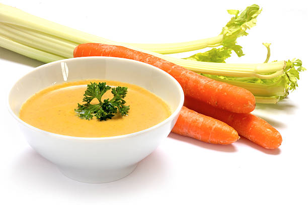 istock vegetable carrot cream soup with celery , white background 519310684