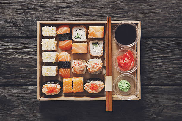 istock Set of sushi maki and rolls at black rustic wood 519314346