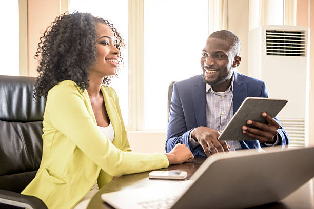 Young professionals working with laptops in Nigeria