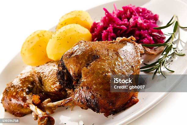 Roast Duck Thighs Boiled Potatoes And Red Cabbage Stock Photo - Download Image Now - Animal Body Part, Animal Leg, Animal Limb