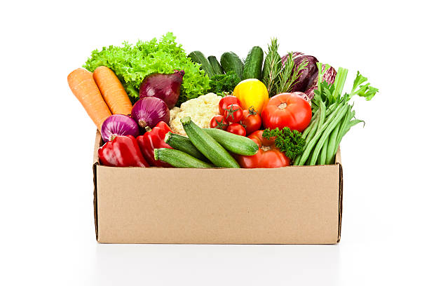 istock Crate filled with assortment of organic vegetables on white backdrop 519316120