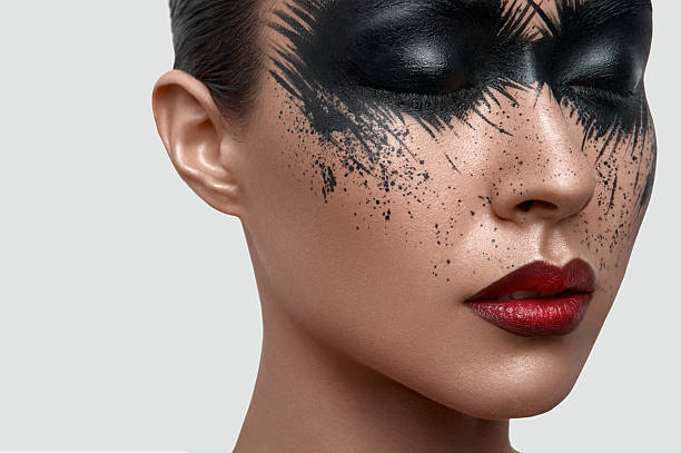 istock Beauty Model with black Paint Stains on Face 519316378