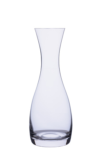 Empty glass carafe insulated on white background