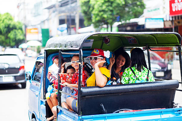 Bangkok, Thailand - March 22, 2016: Tuk-Tuks in downtown China Town. Tuk-Tuks are the typical way to travel fast and cheap within the city limits of Bangkok.