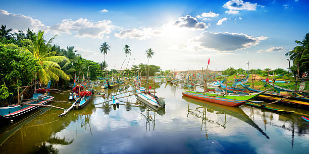 Boats in tropical bay Colored boats in tropical bay of Sri Lanka southern sri lanka stock pictures, royalty-free photos & images