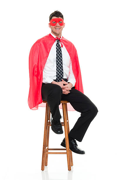 istock Smiling superhero sitting on stool 519321294