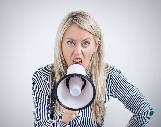 istock Woman screaming on megaphone 519326065