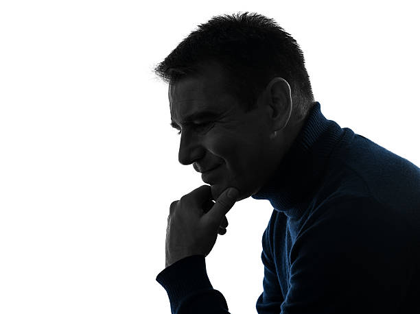 istock man serious thinking pensive silhouette portrait 519327777