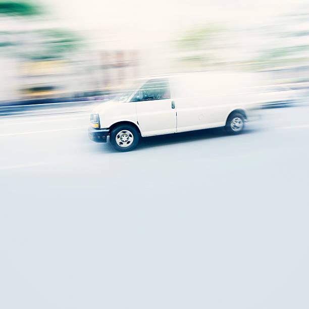 istock Commercial white van speeding in New York 519329101