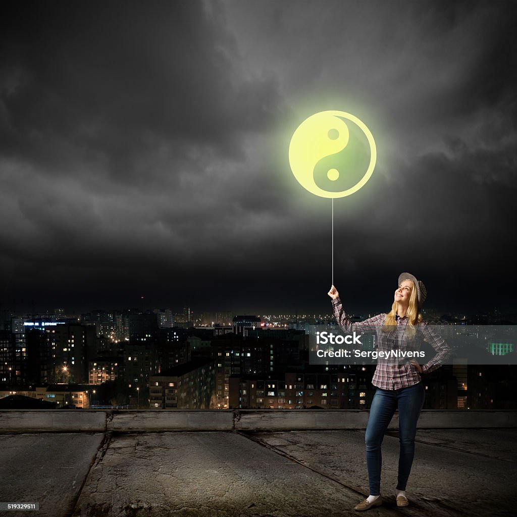 Woman with balloon Young girl in casual and yin yang sign Adult Stock Photo