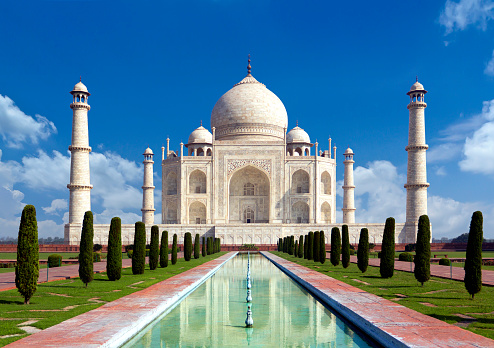 Taj mahal on a bright day in Agra, India - A monument of love in clear blue sky