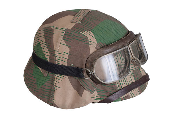 istock camouflaged nazi german helmet with protective goggles 519330143