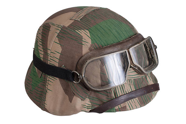 istock camouflaged nazi german helmet with protective goggles 519330145