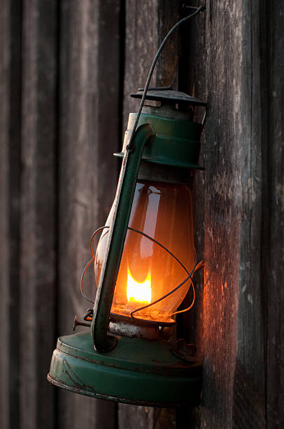 istock vintage kerosene lamp hanging on the wooden wall 519330242