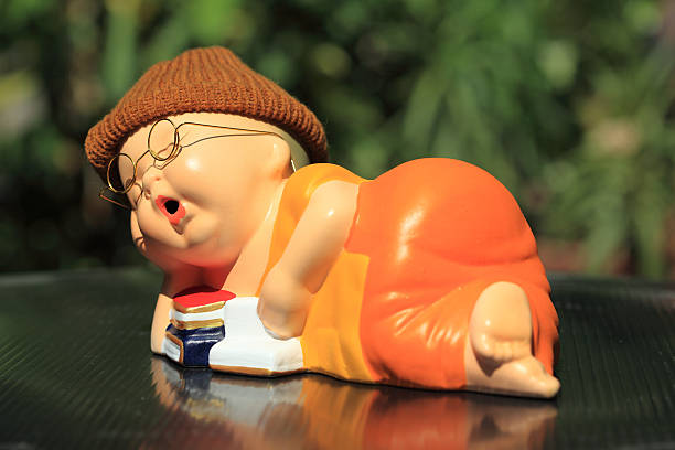 istock Little Monk Porcelain doll 519330546