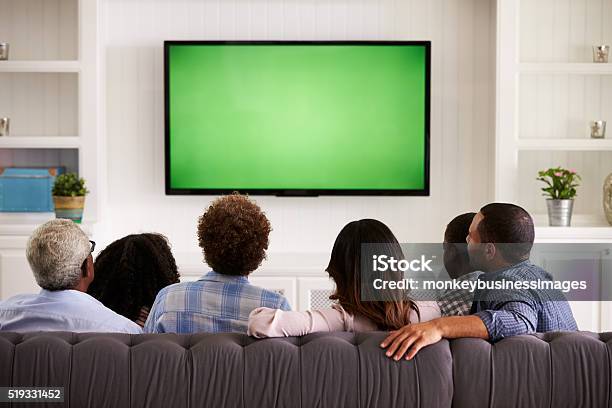 Multi Generation Family Watching Tv At Home Back View Stock Photo - Download Image Now