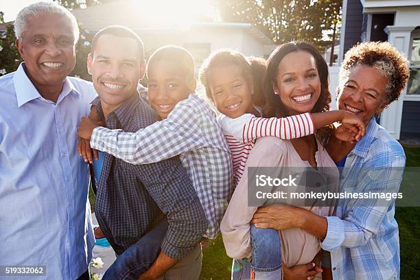Black Multi Generation Family Outside Backlit Portrait Stock Photo - Download Image Now