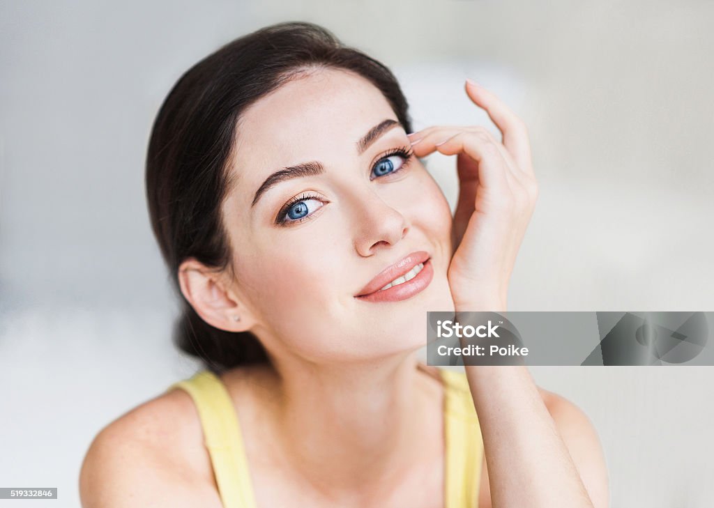 Close-up portrait of beautiful women Young woman touching her face Beauty Stock Photo