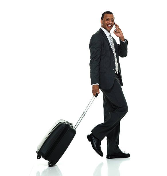 istock Smiling businessman on phone and walking 519333662