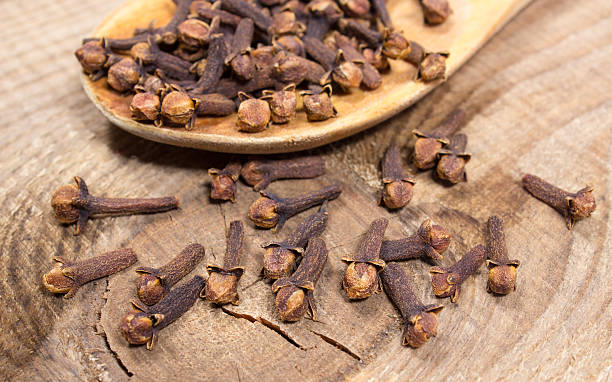 istock Cloves on a wood board. 519333976