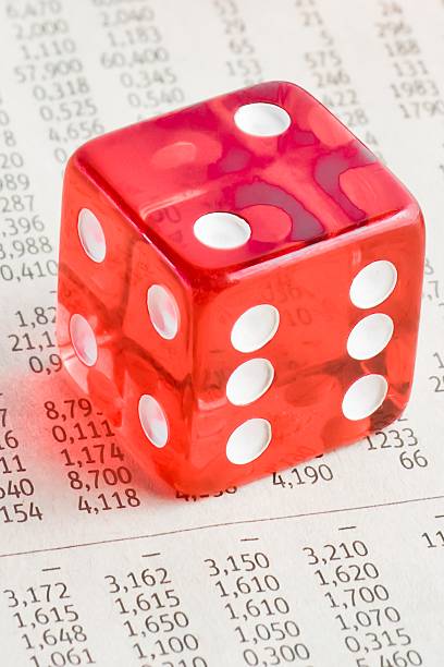 istock one red dice on the financial newspaper 519336522