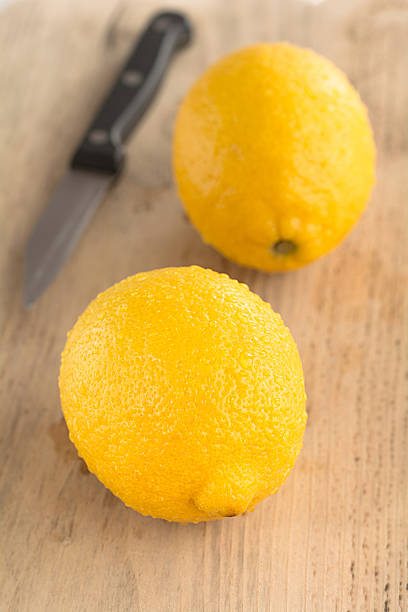 istock Lemons lie on a wooden board 519336962