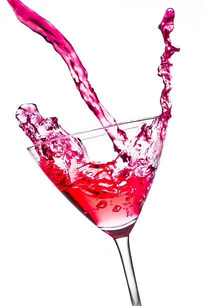 istock red cocktail with splashing in the tilted glass 519339304