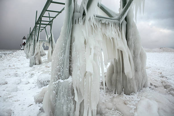istock Ice encrusted pier and walkway on Lake Michigan. 519340780