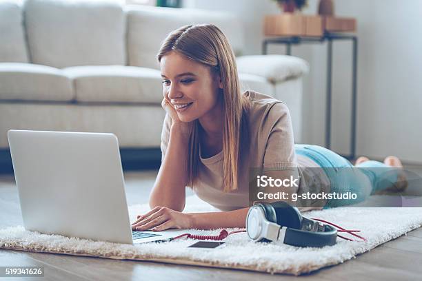 Relaxing At Home Stock Photo - Download Image Now - Laptop, Flooring, Headphones