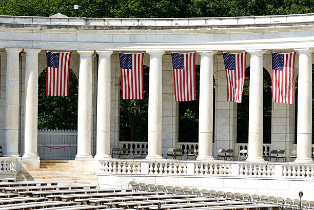 U.S. Flags at Memorial Amphitheater, Arlington National Cemetery Arlington, Virginia, USA - May 24, 2015: U.S. flags hang inside the Memorial Amphitheater at Arlington National Cemetery during Memorial Day weekend events. memorial amphitheater stock pictures, royalty-free photos & images