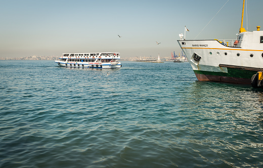 Istanbul, Turkey - April 06, 2016: Ferry boat leaving the pier of Kadikoy in Istanbul, Turkey