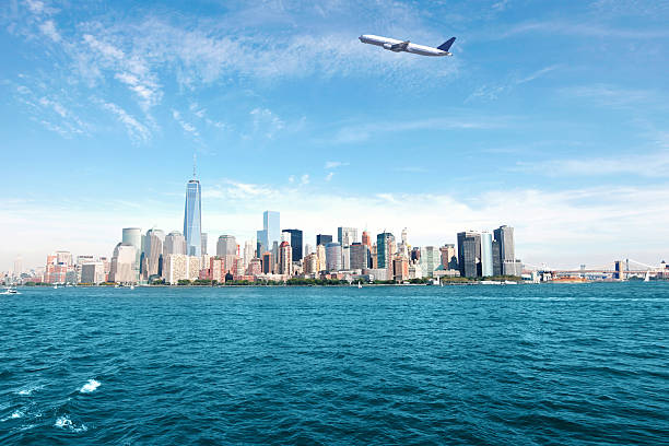 istock New York City Skyline with Airplane 519356026