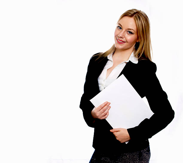 Young business woman on white background holding white folder stock photo