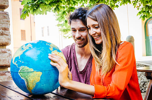 istock Young Couple Thinking About Where To Go On Trip 519358867