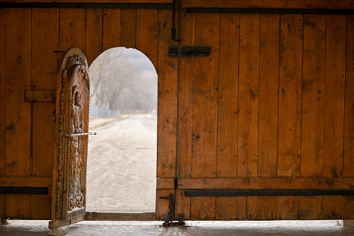 Open wooden door of outside wall and bokeh