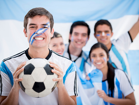 Happy group of Argentinean football fans