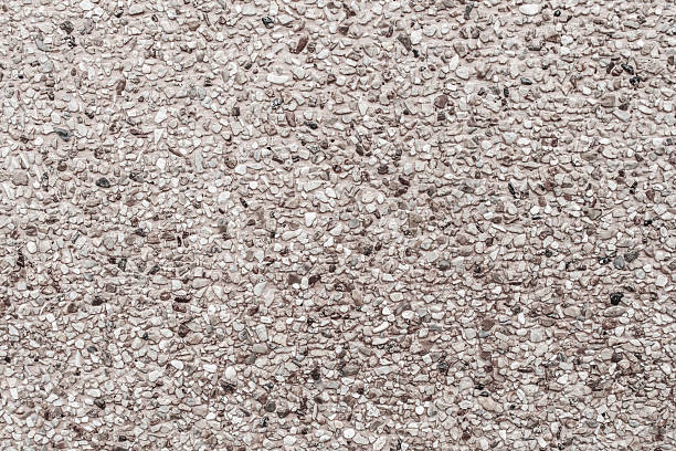 istock surface wall of stones and sand stucco texture background 519361915