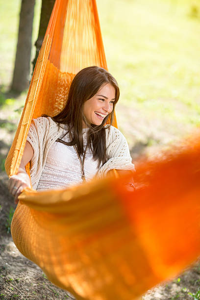 istock Woman lying and enjoying in hammock 519362084